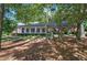 Brick ranch home with covered porch and mature trees at 45 Latimer Nw Ln, Cartersville, GA 30121