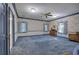 Large bedroom with floral wallpaper and blue carpet at 45 Latimer Nw Ln, Cartersville, GA 30121
