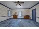 Large bedroom with floral wallpaper and blue carpet at 45 Latimer Nw Ln, Cartersville, GA 30121