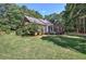 Side view of brick home showcasing landscaping at 45 Latimer Nw Ln, Cartersville, GA 30121