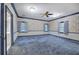 Spacious bedroom with blue carpeting and floral wallpaper at 45 Latimer Nw Ln, Cartersville, GA 30121