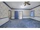 Large bedroom with blue carpeting and floral wallpaper, and ensuite bathroom at 45 Latimer Nw Ln, Cartersville, GA 30121
