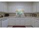 White kitchen with stainless steel sink and updated countertops at 45 Latimer Nw Ln, Cartersville, GA 30121