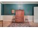 Study with brick floors, antique furniture and teal walls at 45 Latimer Nw Ln, Cartersville, GA 30121
