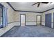 Spacious bedroom with blue carpet, floral wallpaper, and multiple closets at 45 Latimer Nw Ln, Cartersville, GA 30121