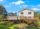 Back exterior showcasing a large deck and spacious yard at 3188 Village Glen Dr, Snellville, GA 30039