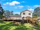 Home features a large deck and grassy backyard at 3188 Village Glen Dr, Snellville, GA 30039