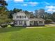 Charming two-story home with a spacious lawn at 3188 Village Glen Dr, Snellville, GA 30039