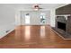 Bright living room with hardwood floors and a brick fireplace at 3188 Village Glen Dr, Snellville, GA 30039