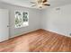 Spacious bedroom with hardwood floors and a ceiling fan at 3188 Village Glen Dr, Snellville, GA 30039