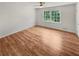 Spacious bedroom with hardwood floors and large windows at 3188 Village Glen Dr, Snellville, GA 30039
