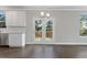 Kitchen features white cabinets, granite countertops and access to deck at 6067 Ruby Falls, Stonecrest, GA 30038