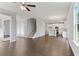 Open Gathering room with hardwood floors, kitchen and staircase views at 6067 Ruby Falls, Stonecrest, GA 30038