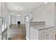 Open kitchen with granite counters, island and Gathering room view at 6067 Ruby Falls, Stonecrest, GA 30038