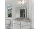 Small bathroom with granite countertop and single sink at 6067 Ruby Falls, Stonecrest, GA 30038