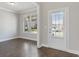 Bright entryway with hardwood floors and window at 6067 Ruby Falls, Stonecrest, GA 30038