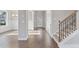 Bright entryway with hardwood floors and staircase with iron railing at 6067 Ruby Falls, Stonecrest, GA 30038