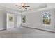 Spacious main bedroom with ample natural light and carpet flooring at 6067 Ruby Falls, Stonecrest, GA 30038
