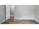 Grey walls and wood-look floors in a bedroom at 4598 Plum Orchard Ln, Stone Mountain, GA 30083