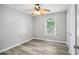 Bright bedroom with ceiling fan and wood-look floors at 4598 Plum Orchard Ln, Stone Mountain, GA 30083