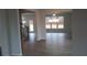 Open concept dining room with hardwood floors and chandelier at 6093 Ruby Falls Way, Stonecrest, GA 30038