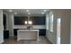 Modern kitchen with dark cabinetry, white countertops and island at 6093 Ruby Falls Way, Stonecrest, GA 30038
