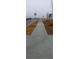 Wide concrete sidewalk leading through the neighborhood at 6093 Ruby Falls Way, Stonecrest, GA 30038
