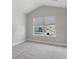 Cozy bedroom with carpet and large window overlooking the neighborhood at 6103 Ruby Falls, Stonecrest, GA 30038