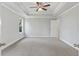 Main bedroom with ceiling fan and door to en-suite bathroom at 6103 Ruby Falls, Stonecrest, GA 30038
