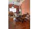 Bright dining area with hardwood floors and a glass-top table at 119 Holiday Rd, Buford, GA 30518