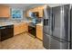 Modern kitchen featuring stainless steel appliances and light wood cabinets at 6531 Arbor Gate Sw Dr # 12, Mableton, GA 30126