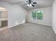 Bright and airy bedroom with plush carpeting and large window at 6531 Arbor Gate Sw Dr # 12, Mableton, GA 30126