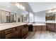 Luxurious bathroom with a soaking tub, double vanity, and walk-in shower at 6175 Grindle Rd, Cumming, GA 30041