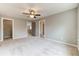Spacious bedroom with neutral walls and carpeted floor, featuring a ceiling fan at 6175 Grindle Rd, Cumming, GA 30041