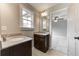 Simple bathroom with single vanity and a view of a bedroom at 6175 Grindle Rd, Cumming, GA 30041