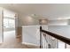 Upper hallway with carpeting, leading to bedrooms and offering an open feel at 6175 Grindle Rd, Cumming, GA 30041