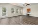 Spacious living room with hardwood floors and lots of natural light at 7041 Livia Pt, Riverdale, GA 30296
