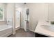 Bathroom boasts a soaking tub, walk-in shower, and double vanity at 7041 Livia Pt, Riverdale, GA 30296