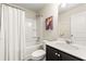 Clean bathroom with tub shower combo and dark vanity at 7041 Livia Pt, Riverdale, GA 30296