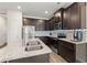 Modern kitchen with stainless steel appliances and granite countertops at 7041 Livia Pt, Riverdale, GA 30296