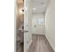 Convenient powder room with pedestal sink and mirror at 7041 Livia Pt, Riverdale, GA 30296