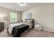 Cozy bedroom with a queen bed and window seat at 7041 Livia Pt, Riverdale, GA 30296