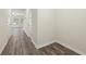 Main level hallway with wood-look flooring and access to other rooms at 7041 Livia Pt, Riverdale, GA 30296