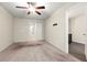 Bright bedroom with plush carpeting and ceiling fan at 7041 Livia Pt, Riverdale, GA 30296
