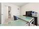 Bright home office features a large glass-top desk, and plenty of space at 7041 Livia Pt, Riverdale, GA 30296