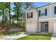 Front view of a two-story townhome at 7041 Livia Pt, Riverdale, GA 30296