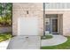 Front view of a townhome with garage at 7041 Livia Pt, Riverdale, GA 30296