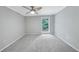 Spacious bedroom with carpeted floor and large window at 707 Cumberland Se Ct, Smyrna, GA 30080