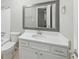 Clean bathroom with white vanity and large mirror at 707 Cumberland Se Ct, Smyrna, GA 30080