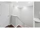 Simple staircase with neutral walls and hardwood floors at 707 Cumberland Se Ct, Smyrna, GA 30080